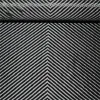 Chevron-pattern woven carbon fiber fabric close-up