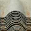 Background of heap of aged rough shabby slate for repairing roof of house