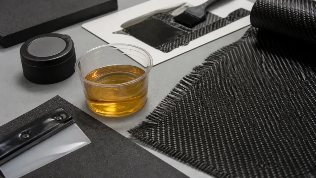Epoxy resin and carbon fiber fabric prepared for a controlled layup