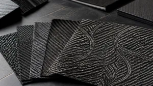 Jacquard carbon fiber fabric swatches with varied woven patterns